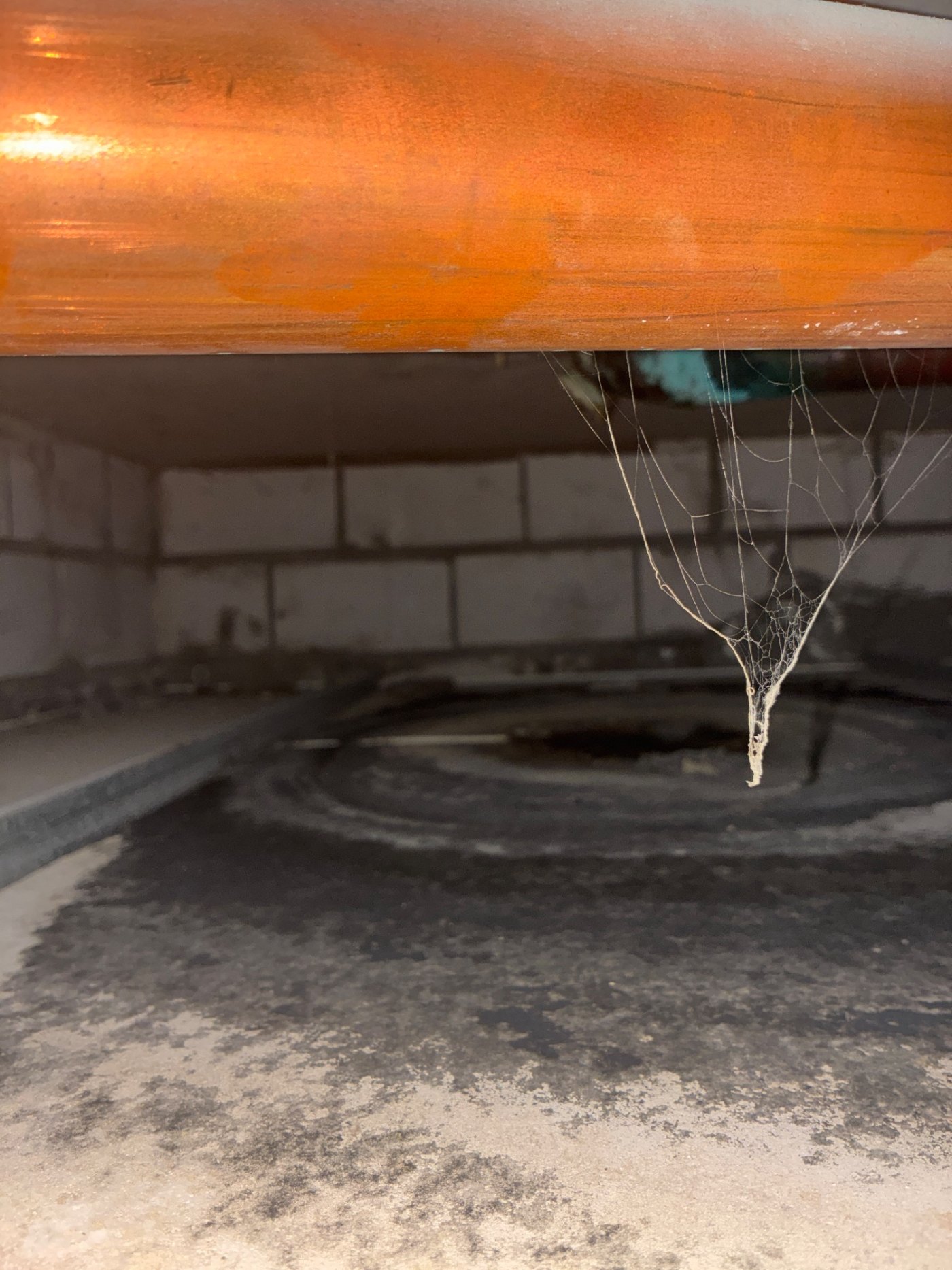 The same ceiling space, wider view. The staining across the tiles is what tells you how long it had been running.